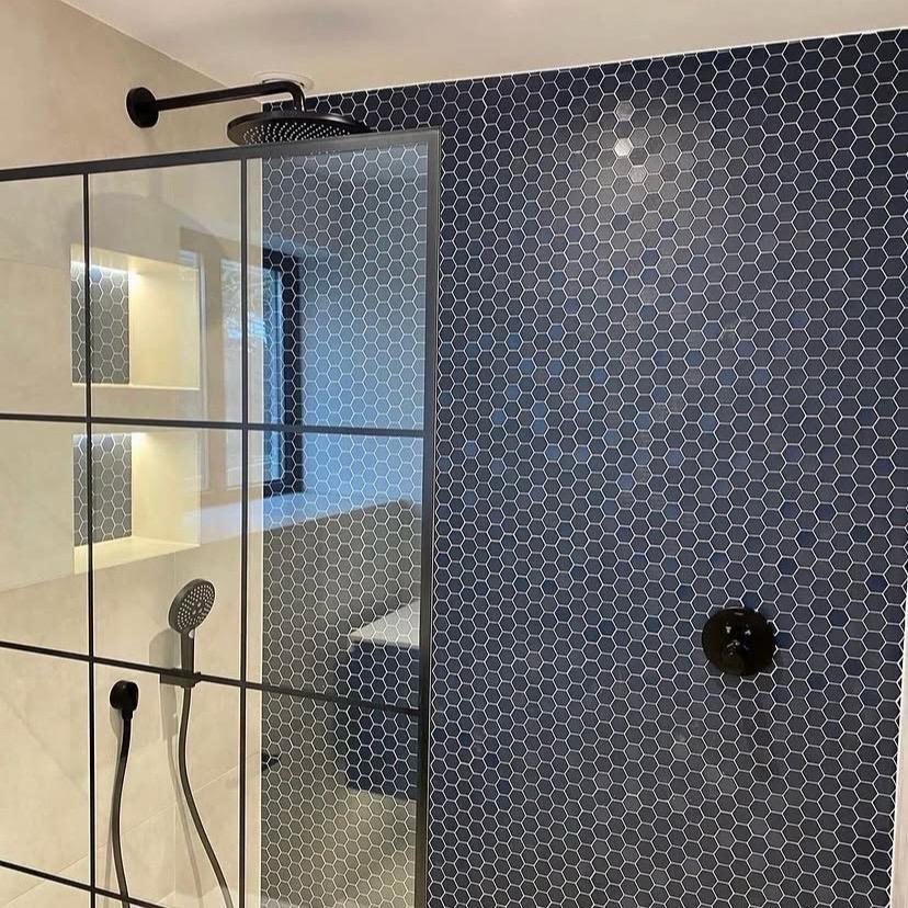 Luxury walk-in rainfall shower with feature niches
