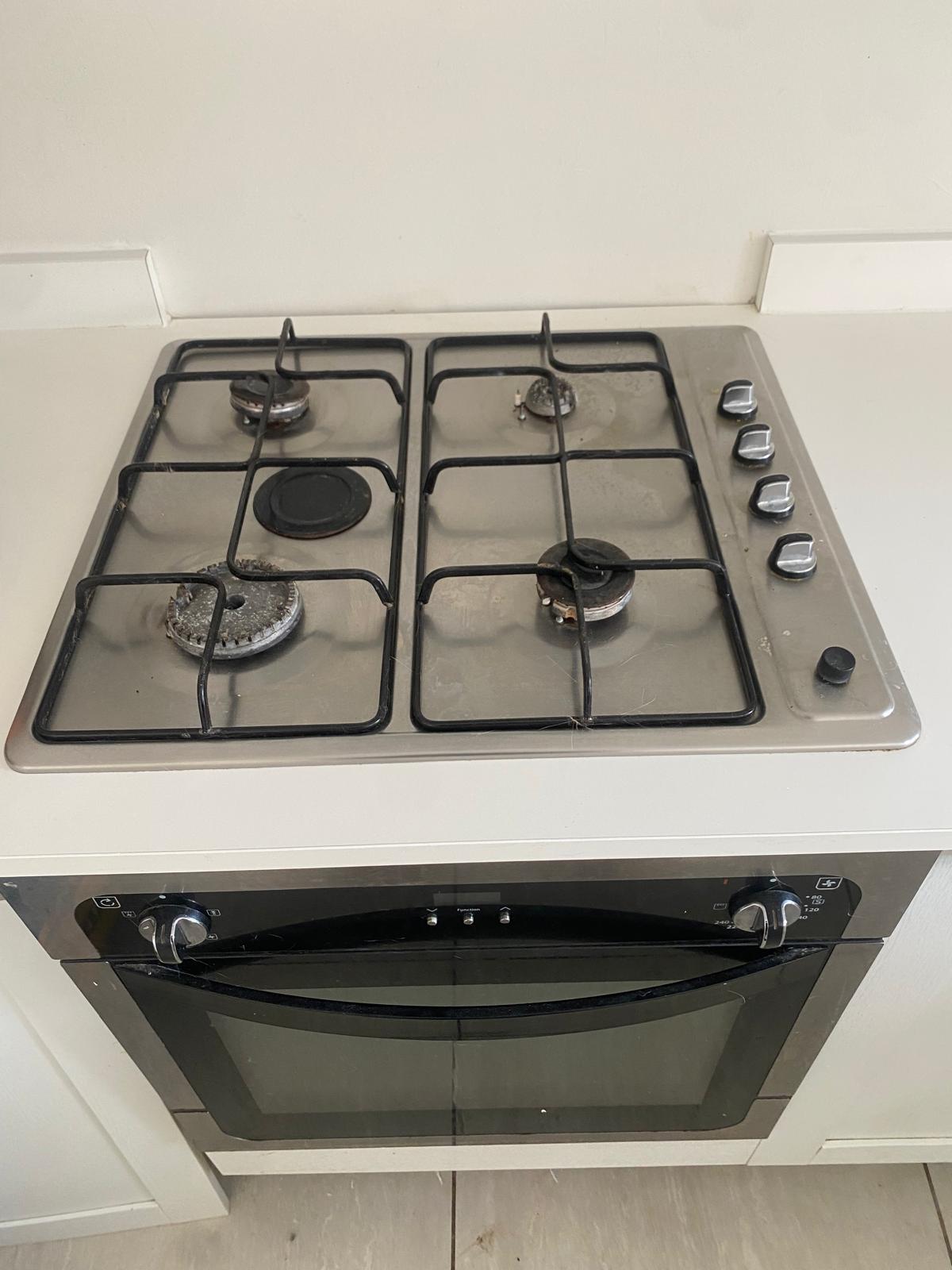 Before: Corroded 4-burner gas hob