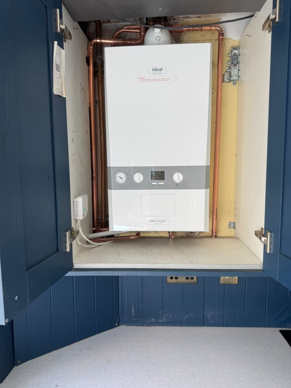 Ideal Independent combi boiler freshly installed with neat copper pipework